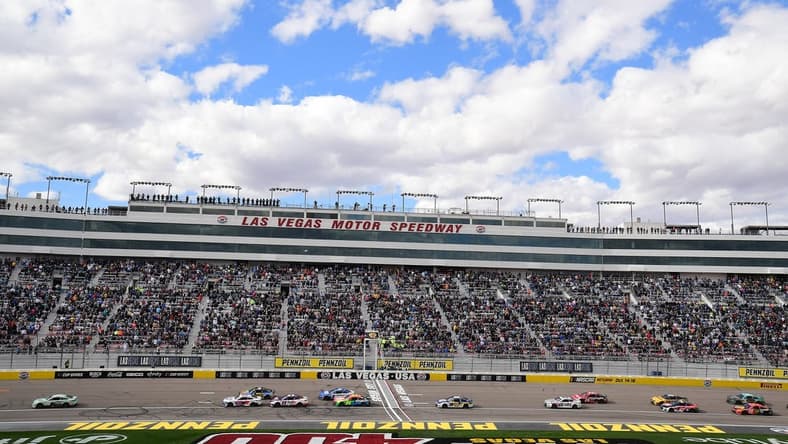 Mar 6, 2022; Las Vegas, Nevada, USA; NASCAR Cup Series driver Kyle Busch (18) leads during the Pennzoil 400 at Las Vegas Motor Speedway. Mandatory Credit: Gary A. Vasquez-USA TODAY Sports