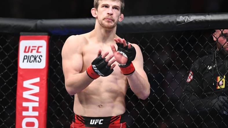 Mar 19, 2022; London, UK; Arnold Allen (red gloves) before his fight against Dan Hooker (blue gloves) during UFC Fight Night at O2 Arena. Mandatory Credit: Per Haljestam-USA TODAY Sports