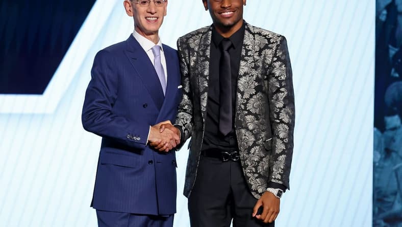 Jun 23, 2022; Brooklyn, NY, USA; Malaki Branham (Ohio State) shakes hands with NBA commissioner Adam Silver after being selected as the number twenty overall pick by the San Antonio Spurs in the first round of the 2022 NBA Draft at Barclays Center. Mandatory Credit: Brad Penner-USA TODAY Sports