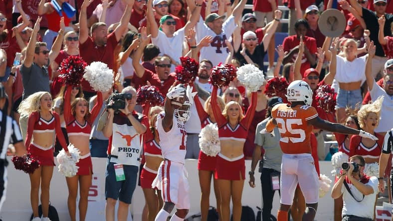 Oklahoma's Marvin Mims (17) celebrates beside Texas' B.J. Foster (25) after catching a pass for a touchdown during the Red River Showdown college football game between the University of Oklahoma Sooners (OU) and the University of Texas (UT) Longhorns at the Cotton Bowl in Dallas, Saturday, Oct. 9, 2021.  Oklahoma won 55-48.

cover main