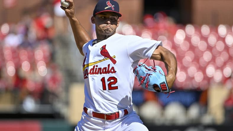 Jul 10, 2022; St. Louis, Missouri, USA; St. Louis Cardinals relief pitcher Jordan Hicks (12) pitches against the Philadelphia Phillies during the eighth inning at Busch Stadium. Mandatory Credit: Jeff Curry-USA TODAY Sports