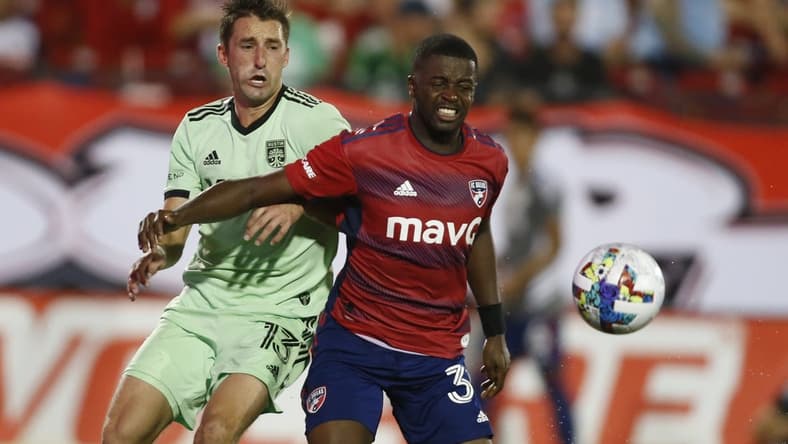 Jul 16, 2022; Frisco, Texas, USA; Austin FC midfielder Ethan Finlay (13) and FC Dallas defender Nan   (31) fight for a ball in the second half at Toyota Stadium. Mandatory Credit: Tim Heitman-USA TODAY Sports