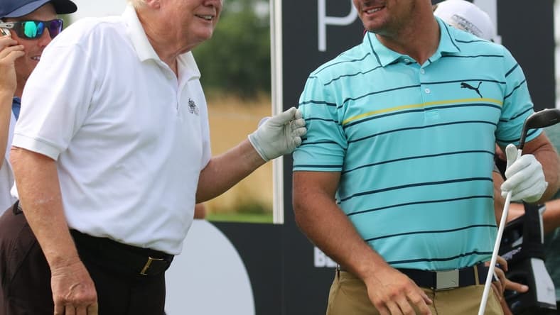 July 28, 2022; Bedminster, NJ, USA; Donald Trump with Bryson DeChambeau during the Pro Am. The LIV Pro Am Tournament featured the former President of the United States, Donald Trump and his son Eric Trump playing with with Dustin Johnson and Bryson DeChambeau at Trump National in Bedminster, NJ on July 28, 2022. Mandatory Credit: Chris Pedota-USA TODAY NETWORK
