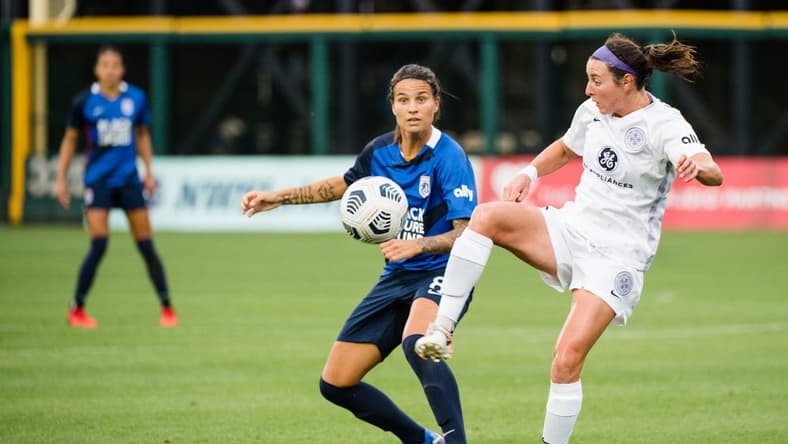 TACOMA, WA - JULY 31: Erin Simon #3 of Racing Louisville FC clears the ball during a game between Racing Louisville FC and OL Reign at Cheney Stadium on July 31, 2021 in Tacoma, Washington. Mandatory credit: Jane Gershovich/ISI Photos via Imagn