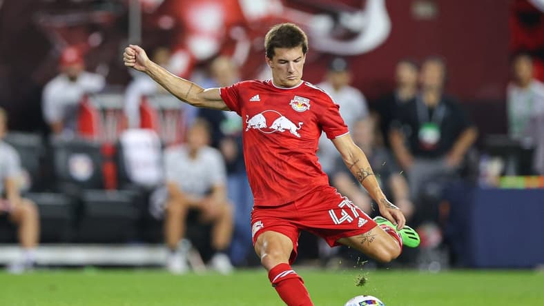 Aug 2, 2022; Harrison, New Jersey, USA; New York Red Bulls defender John Tolkin (47) kicks the ball against the Colorado Rapids during the second half at Red Bull Arena. Mandatory Credit: Vincent Carchietta-USA TODAY Sports
