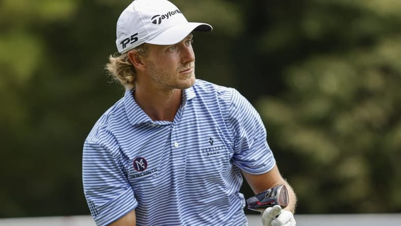 Aug 4, 2022; Greensboro, North Carolina, USA; Austin Smotherman watches his tee shot on the 18th tee during the first round of the Wyndham Championship golf tournament. Mandatory Credit: Nell Redmond-USA TODAY Sports