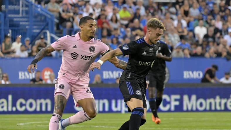 Aug 6, 2022; Montreal, Quebec, CAN; CF Montreal midfielder Djordje Mihailovic (8) plays the ball against Inter Miami CF midfielder Gregore (26) during the first half at Stade Saputo. Mandatory Credit: Eric Bolte-USA TODAY Sports