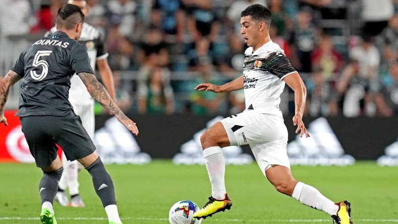 Aug 10, 2022; Saint Paul, MN, USA; Liga MX midfielder Erik Lira (6) of Cruz Azul moves the ball against MLS forward Taxiarchis Fountas (5) of DC United during the MLS All-Star Game at Allianz Field. Mandatory Credit: John David Mercer-USA TODAY Sports