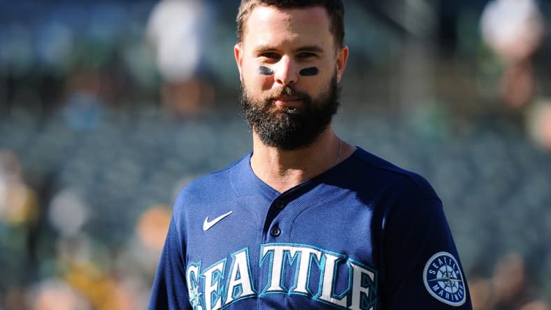 Aug 20, 2022; Oakland, California, USA; Seattle Mariners left fielder Jesse Winker (27) returns to the dugout after the top of the third inning against the Oakland Athletics at RingCentral Coliseum. Mandatory Credit: Kelley L Cox-USA TODAY Sports