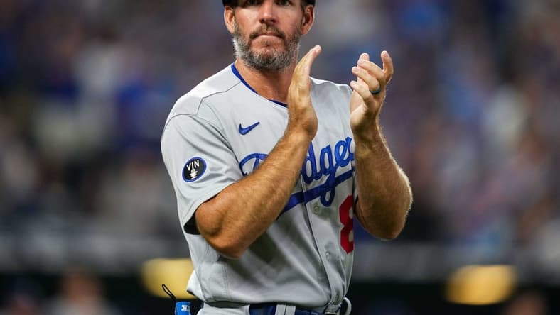 Aug 12, 2022; Kansas City, Missouri, USA; Los Angeles Dodgers first base coach Clayton McCullough (86) takes the field during the fifth inning against the Kansas City Royals at Kauffman Stadium. Mandatory Credit: Jay Biggerstaff-USA TODAY Sports