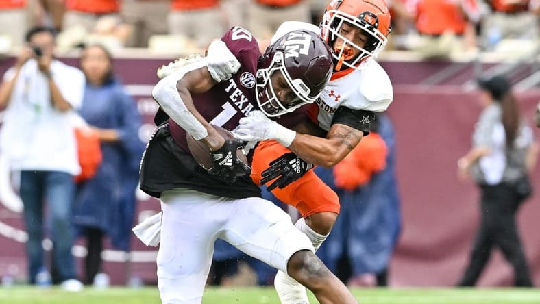 Sep 3, 2022; College Station, Texas, USA;  Texas A&M Aggies wide receiver Chris Marshall (10) is tackled by Sam Houston State Bearkats defensive back Isaiah Downes (4) during the second half at Kyle Field. Mandatory Credit: Maria Lysaker-USA TODAY Sports