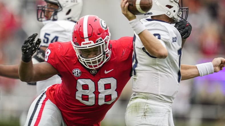 Sep 10, 2022; Athens, Georgia, USA; Georgia Bulldogs defensive lineman Jalen Carter (88) hits Samford Bulldogs quarterback Michael Hiers (10) during the first half at Sanford Stadium. Mandatory Credit: Dale Zanine-USA TODAY Sports