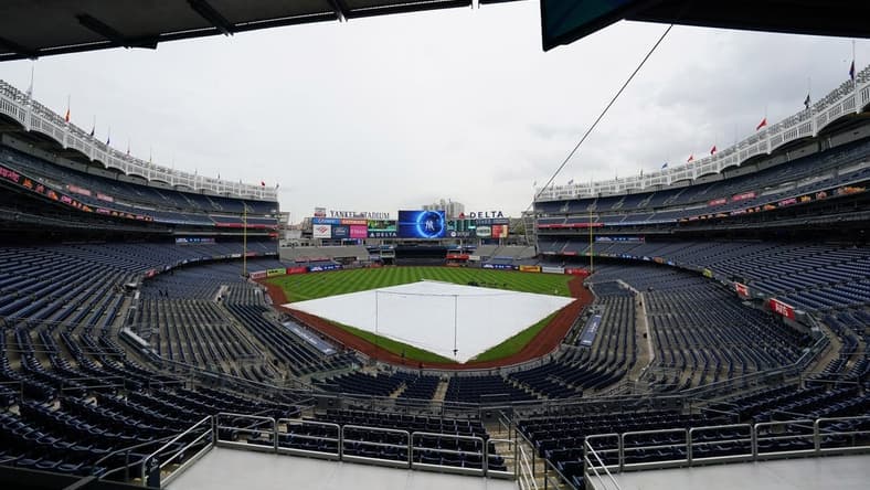 Sep 11, 2022; Bronx, New York, USA; The tarp is on the field due to rain and a delayed start prior to the game between the Tampa Bay Rays and New York Yankees at Yankee Stadium. Mandatory Credit: Gregory Fisher-USA TODAY Sports