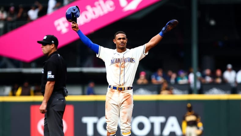 Sep 14, 2022; Seattle, Washington, USA; Seattle Mariners center fielder Julio Rodriguez (44) acknowledges the crowd after stealing second base to reach 25 home runs and 25 stolen bases for the year at T-Mobile Park. Mandatory Credit: Lindsey Wasson-USA TODAY Sports