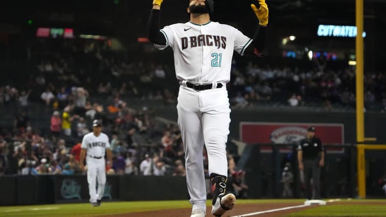 Sep 15, 2022; Phoenix, Arizona, USA; Arizona Diamondbacks third baseman Emmanuel Rivera crosses home plate after hitting a solo home run against the San Diego Padres during the fourth inning at Chase Field. Mandatory Credit: Joe Camporeale-USA TODAY Sports