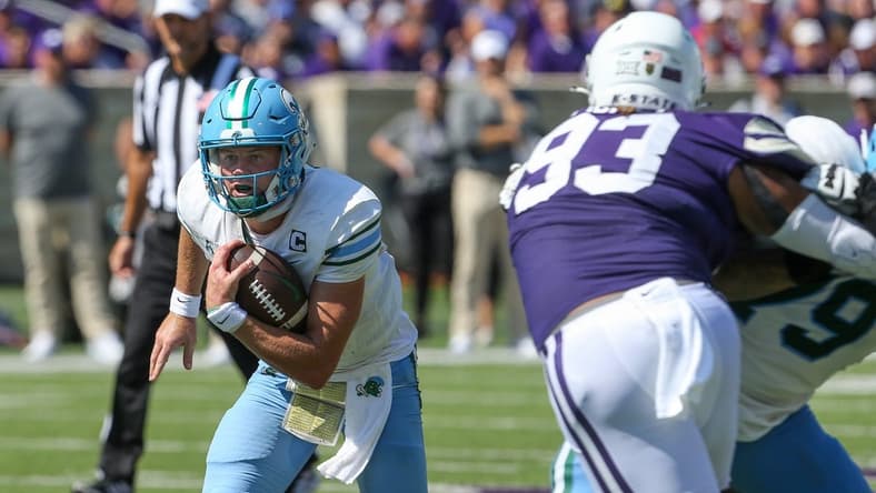 Sep 17, 2022; Manhattan, Kansas, USA; Tulane Green Wave quarterback Michael Pratt (7) runs by Kansas State Wildcats defensive end Jaylen Pickle (93) during the first quarter at Bill Snyder Family Football Stadium. Mandatory Credit: Scott Sewell-USA TODAY Sports
