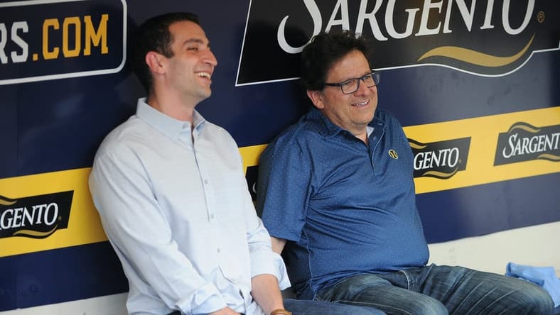 Sep 17, 2022; Milwaukee, Wisconsin, USA; Milwaukee Brewers Baseball Operations and General Manager David Stearns and Milwaukee Brewers Owner Mark Attanasio share a laugh while talking in the dugout before their game against the New York Yankees at American Family Field. Mandatory Credit: Michael McLoone-USA TODAY Sports