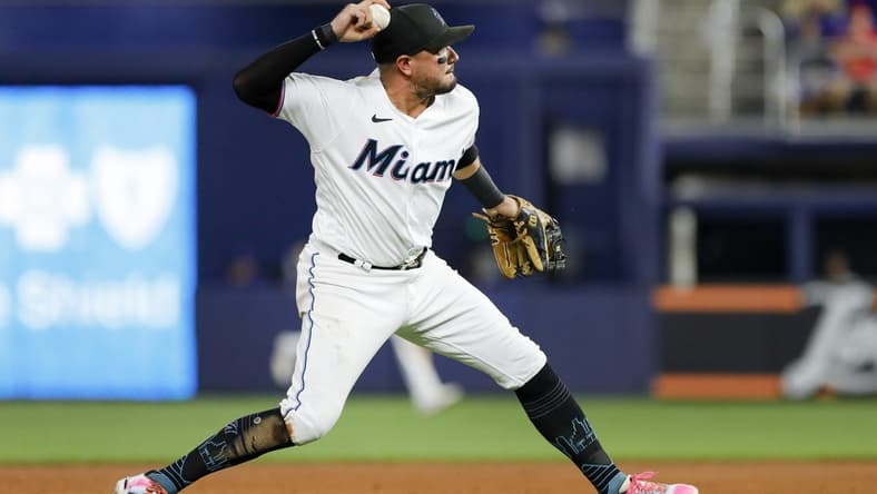 Sep 19, 2022; Miami, Florida, USA; Miami Marlins shortstop Miguel Rojas (11) throws to first base to for an out during the fifth inning at loanDepot Park. Mandatory Credit: Sam Navarro-USA TODAY Sports