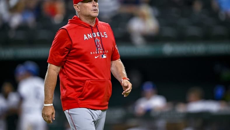 Sep 21, 2022; Arlington, Texas, USA; Los Angeles Angels interim manager Phil Nevin (88) walks back to the dugout during the game between the Texas Rangers and the Los Angeles Angels at Globe Life Field. Mandatory Credit: Jerome Miron-USA TODAY Sports