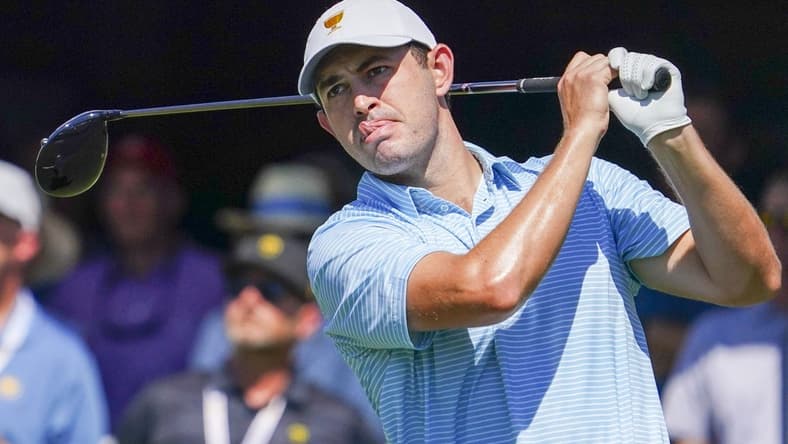 Sep 22, 2022; Charlotte, North Carolina, USA; Team USA golfer Patrick Cantlay hits his tee shot on the first hole during the foursomes match play of the Presidents Cup golf tournament at Quail Hollow Club. Mandatory Credit: Peter Casey-USA TODAY Sports