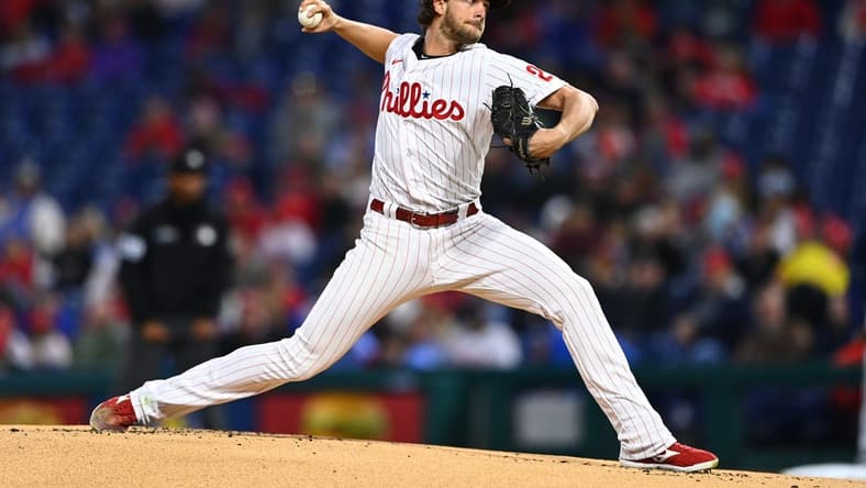 Sep 23, 2022; Philadelphia, Pennsylvania, USA; Philadelphia Phillies pitcher Aaron Nola (27) throws a pitch against the Atlanta Braves in the first inning at Citizens Bank Park. Mandatory Credit: Kyle Ross-USA TODAY Sports