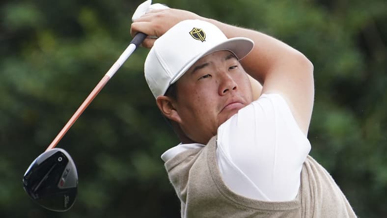 Sep 24, 2022; Charlotte, North Carolina, USA; International Team golfer Sungjae Im hits his tee shot on the 10th hole during the foursomes match play of the Presidents Cup golf tournament at Quail Hollow Club. Mandatory Credit: Peter Casey-USA TODAY Sports