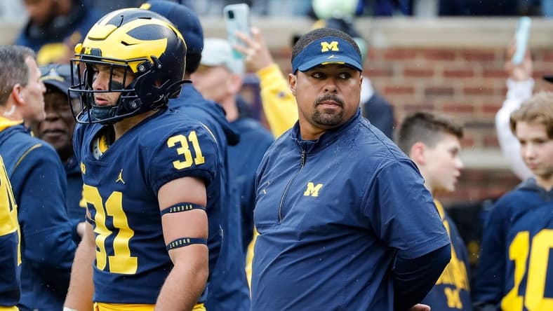 Michigan running back coach Mike Hart watches warm ups ahead of the Maryland game at Michigan Stadium in Ann Arbor on Saturday, Sept. 24, 2022.