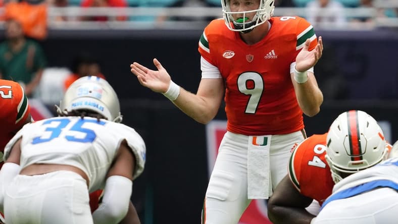 Sep 24, 2022; Miami Gardens, Florida, USA; Miami Hurricanes quarterback Tyler Van Dyke (9) signals behind his offense during the first half against the Middle Tennessee Blue Raiders at Hard Rock Stadium. Mandatory Credit: Jasen Vinlove-USA TODAY Sports