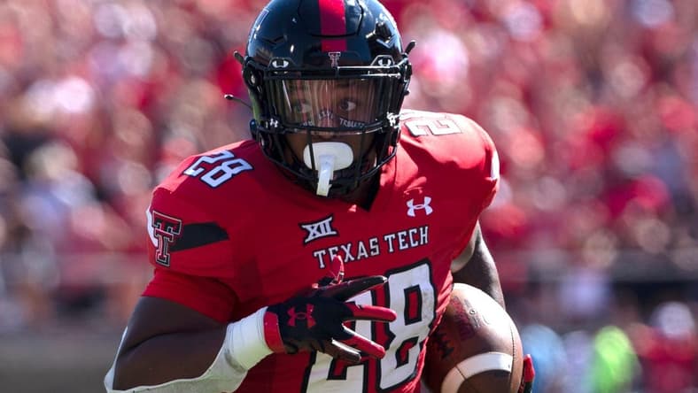 Texas Tech's running back Tahj Brooks (28) runs for a touchdown against Texas, Saturday, Sept. 24, 2022, at Jones AT&T Stadium.