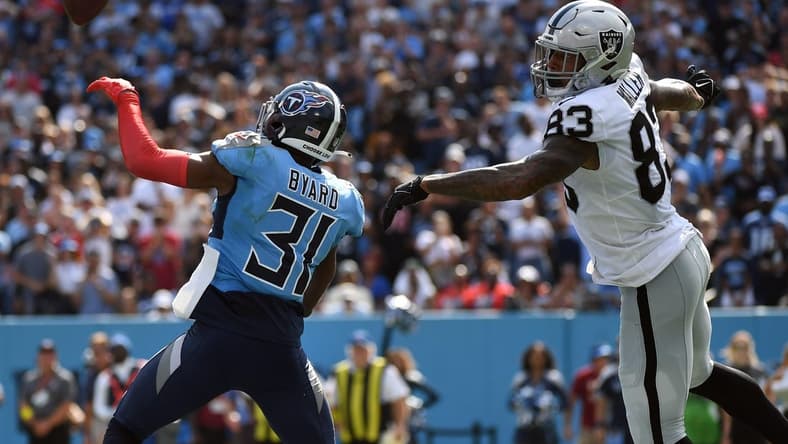Sep 25, 2022; Nashville, Tennessee, USA; Tennessee Titans safety Kevin Byard (31) knocks away the game-tying two-point attempt intended for Las Vegas Raiders tight end Darren Waller (83) during the second half at Nissan Stadium. Mandatory Credit: Christopher Hanewinckel-USA TODAY Sports