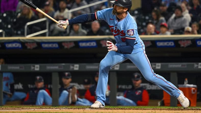 Sep 27, 2022; Minneapolis, Minnesota, USA; Minnesota Twins infielder Jake Cave (8) hits a RBI single against the Chicago White Sox during the second inning at Target Field. Mandatory Credit: Nick Wosika-USA TODAY Sports