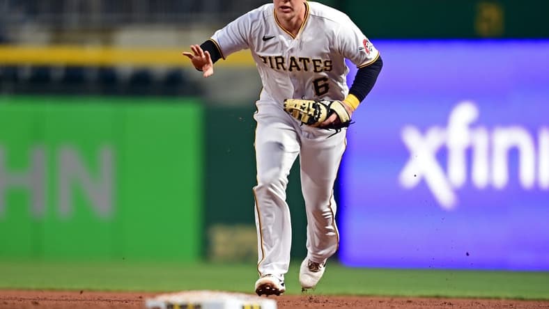 Sep 27, 2022; Pittsburgh, Pennsylvania, USA; Pittsburgh Pirates catcher Zack Collins (6) runs to first base for the force out during the third inning against the Cincinnati Reds at PNC Park. Mandatory Credit: David Dermer-USA TODAY Sports