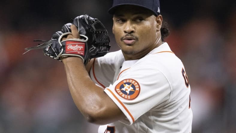 Sep 27, 2022; Houston, Texas, USA; Houston Astros starting pitcher Luis Garcia (77) pitches against the Arizona Diamondbacks in the second inning at Minute Maid Park. Mandatory Credit: Thomas Shea-USA TODAY Sports