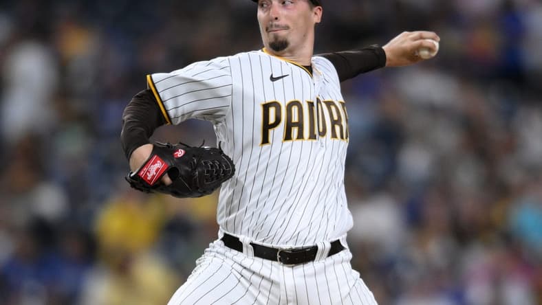 Sep 27, 2022; San Diego, California, USA; San Diego Padres starting pitcher Blake Snell (4) throws a pitch against the Los Angeles Dodgers during the first inning at Petco Park. Mandatory Credit: Orlando Ramirez-USA TODAY Sports