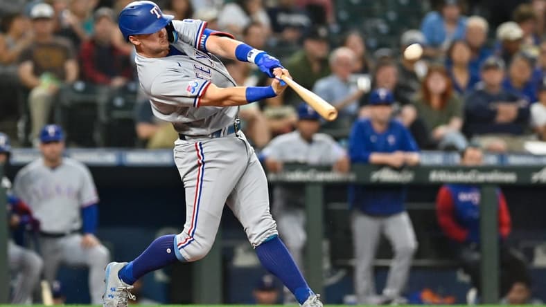 Sep 27, 2022; Seattle, Washington, USA; Texas Rangers third baseman Josh Jung (6) hits a home run against the Seattle Mariners during the second inning at T-Mobile Park. Mandatory Credit: Steven Bisig-USA TODAY Sports