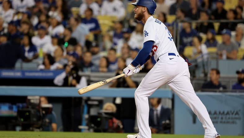 Sep 30, 2022; Los Angeles, California, USA;  Los Angeles Dodgers center fielder Cody Bellinger (35) hits a 3-run home run during the fourth inning against the Colorado Rockies at Dodger Stadium. Mandatory Credit: Kiyoshi Mio-USA TODAY Sports
