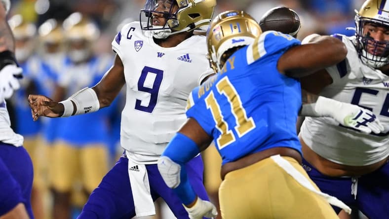Sep 30, 2022; Pasadena, California, USA; Washington Huskies quarterback Michael Penix Jr. (9) sets to pass in the first half against the UCLA Bruins at the Rose Bowl. Mandatory Credit: Jayne Kamin-Oncea-USA TODAY Sports