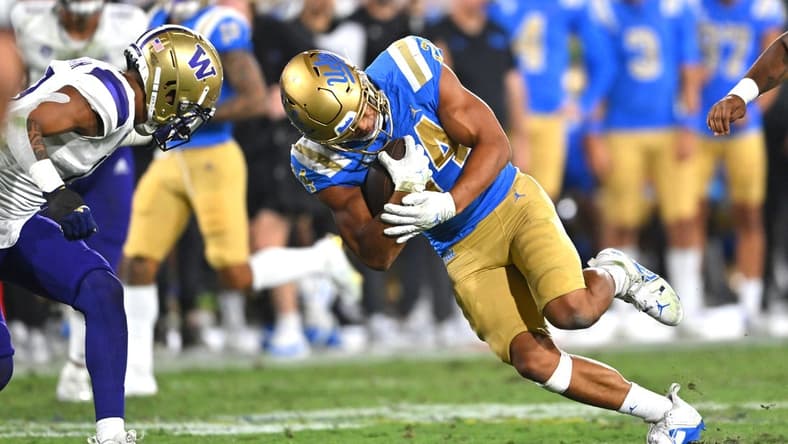 Sep 30, 2022; Pasadena, California, USA; UCLA Bruins running back Zach Charbonnet (24) goes for a first down in the first half against the Washington Huskies at the Rose Bowl. Mandatory Credit: Jayne Kamin-Oncea-USA TODAY Sports