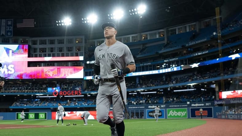 Sep 28, 2022; Toronto, Ontario, CAN; New York Yankees designated hitter Aaron Judge (99) runs towards the dugout during the pregame against the Toronto Blue Jays at Rogers Centre. Mandatory Credit: Nick Turchiaro-USA TODAY Sports