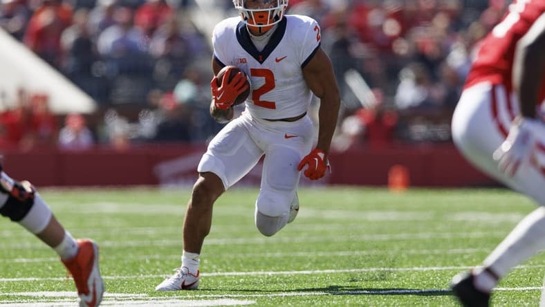 Oct 1, 2022; Madison, Wisconsin, USA;  Illinois Fighting Illini running back Chase Brown (2) rushes with the football during the second quarter against the Wisconsin Badgers at Camp Randall Stadium. Mandatory Credit: Jeff Hanisch-USA TODAY Sports