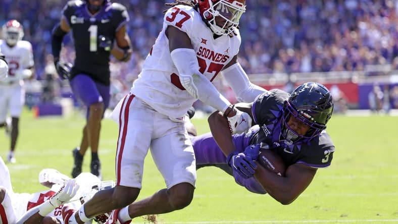 Oct 1, 2022; Fort Worth, Texas, USA;  TCU Horned Frogs running back Emari Demercado (3) dives for yardage as Oklahoma Sooners defensive back Justin Harrington (37) defends during the first half at Amon G. Carter Stadium. Mandatory Credit: Kevin Jairaj-USA TODAY Sports