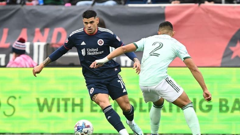 Oct 1, 2022; Foxborough, Massachusetts, USA; New England Revolution forward Gustavo Bou (7) controls the ball in front of Atlanta United defender Ronald Hernandez (2) during the first half at Gillette Stadium. Mandatory Credit: Brian Fluharty-USA TODAY Sports