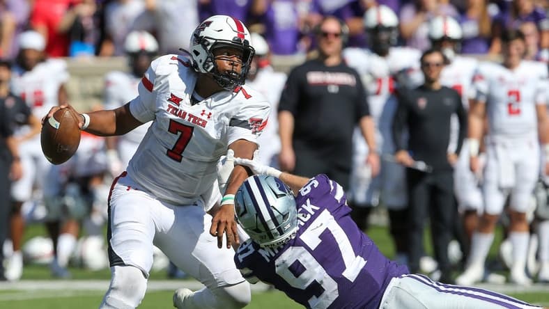 Oct 1, 2022; Manhattan, Kansas, USA; Texas Tech Red Raiders quarterback Donovan Smith (7) breaks away from Kansas State Wildcats defensive end Nate Matlack (97) during the fourth quarter at Bill Snyder Family Football Stadium. Mandatory Credit: Scott Sewell-USA TODAY Sports
