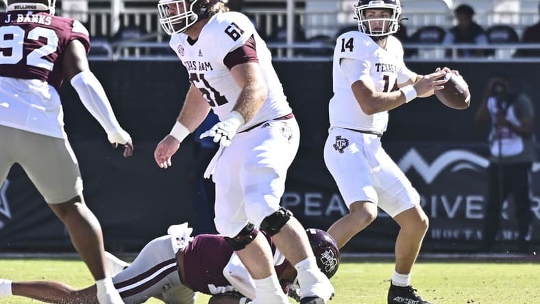 Oct 1, 2022; Starkville, Mississippi, USA; Texas A&M Aggies quarterback Max Johnson (14) looks to pass against the Mississippi State Bulldogs during the first quarter at Davis Wade Stadium at Scott Field. Mandatory Credit: Matt Bush-USA TODAY Sports