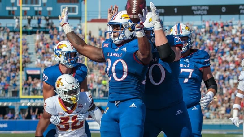 Oct 1, 2022; Lawrence, Kansas, USA; Kansas Jayhawks running back Daniel Hishaw Jr. (20) celebrates in the end zone after a touch down during the second quarter against the Iowa State Cyclones at David Booth Kansas Memorial Stadium. Mandatory Credit: William Purnell-USA TODAY Sports