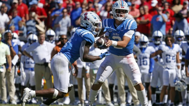 Oct 1, 2022; Oxford, Mississippi, USA; Mississippi Rebels quarterback Jaxson Dart (2) hands the ball off to Mississippi Rebels running back Quinshon Judkins (4) during the third quarter against the Kentucky Wildcats at Vaught-Hemingway Stadium. Mandatory Credit: Petre Thomas-USA TODAY Sports