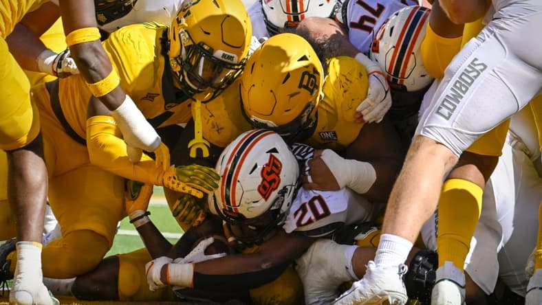 Oct 1, 2022; Waco, Texas, USA; The Baylor Bears defense stops Oklahoma State Cowboys running back Dominic Richardson (20) short of the end zone during the second quarter at McLane Stadium. Mandatory Credit: Jerome Miron-USA TODAY Sports