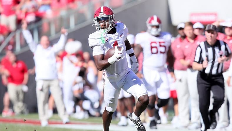 Oct 1, 2022; Fayetteville, Arkansas, USA; Alabama Crimson Tide running back Jahmyr Gibbs (1) runs after a catch in the second quarter against the Arkansas Razorbacks at Donald W. Reynolds Razorback Stadium. Mandatory Credit: Nelson Chenault-USA TODAY Sports