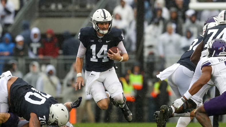 Oct 1, 2022; University Park, Pennsylvania, USA; Penn State Nittany Lions quarterback Sean Clifford (14) runs with the ball during the first quarter against the Northwestern Wildcats at Beaver Stadium. Mandatory Credit: Matthew OHaren-USA TODAY Sports
