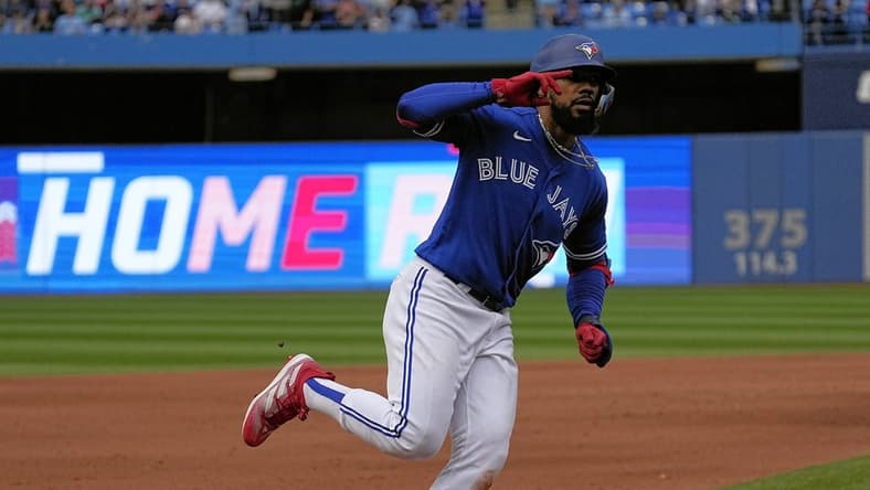Oct 1, 2022; Toronto, Ontario, CAN; Toronto Blue Jays right fielder Teoscar Hernandez (37) celebrates as he rounds the bases after his solo home run against the Boston Red Sox during the fifth inning at Rogers Centre. Mandatory Credit: John E. Sokolowski-USA TODAY Sports